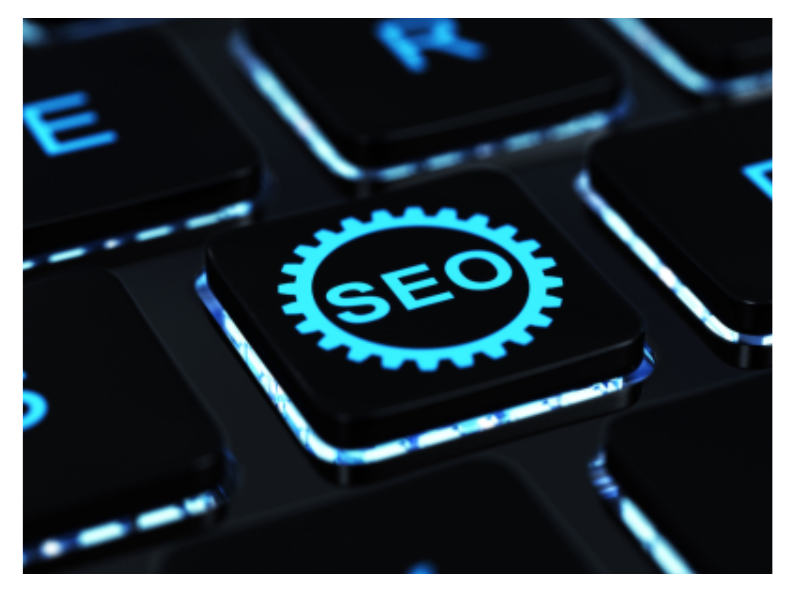 A dark keyboard with a glowing "SEO" key.